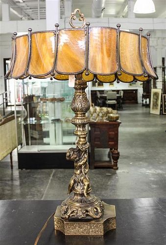 A Leaded Glass Figural Lamp. Height 25 inches.