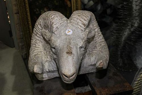 * A Carved Sculpture of a Ram's Head Width 18 inches.