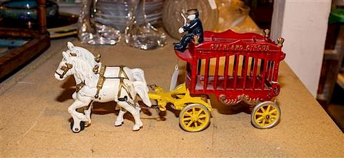 A Cast Iron Toy Wagon, Overland Circus Length overall 13 inches.