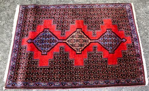 * A Small Persian Rug with Medallion Design 3 feet 4 inches x 2 feet 5 1/2 inches.