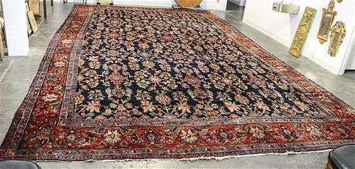 A Persian Wool Rug 22 feet 10 inches x 12 feet 5 inches.