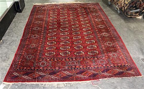 * A Bokhara Wool Rug 8 feet 10 inches x 5 feet 1 inch.