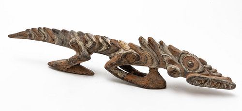 ABORIGINAL CARVED WOOD AND PIGMENT SCULPTURE OF A LIZARD, 20TH C., H 5", L 23" 