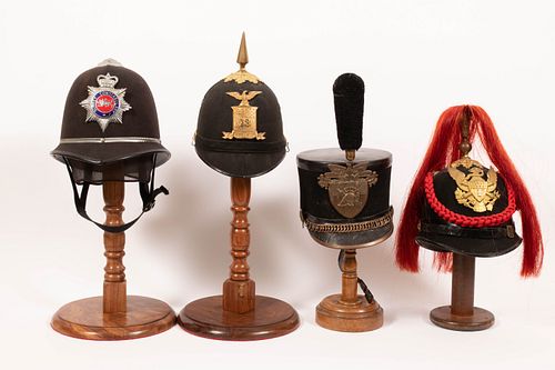 TWO US M1881 HELMETS, ONE WESTPOINT CADET'S SHAKO AND A METROPOLITAN POLICE HAT, 4 PCS, H 10"-13"