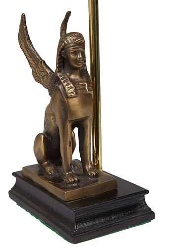 Egyptian Revival Style Patinated Metal Table Lamp, 20th c., with a winged sphinx on a stepped reeded ebonized rectangular base, H.- 12 1/2 in., W.- 6 