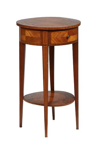 Louis XVI Style Marquetry Inlaid Walnut Lamp Table, late 19th c., the circular top over a wide skirt with a frieze drawer, on tapered square legs join
