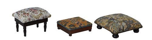 Group of Three French Carved Walnut Footstools, 19th c., one with floral needlepoint upholstery with iron tack decoration on turned legs, H.- 5 3/4 in