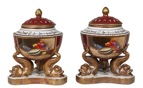 Pair of Chelsea House Porcelain Censers, 20th c.., the pierced gilt decorated lidded urn with an acorn finial, over magenta sides, decorated with a re