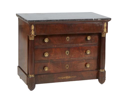 French Empire Style Carved Walnut Ormolu Mounted Marble Top Commode, 19th c., the figured black marble top over a setback frieze drawer above three se