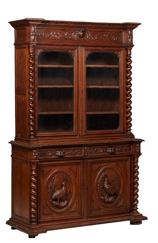 French Henri II Style Carved Oak Buffet a Deux Corps, c. 1880, the stepped breakfront crown over setback double glazed doors, flanked by rope twist co