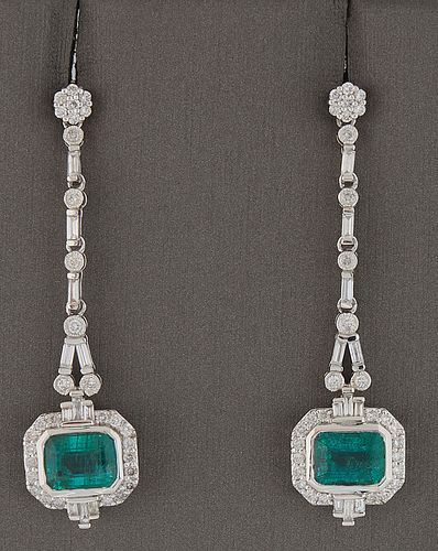 Pair of Platinum Pendant Earrings, with floriform diamond mounted studs to baguette and round diamond mounted chains, suspending a horizontal 2.73 car