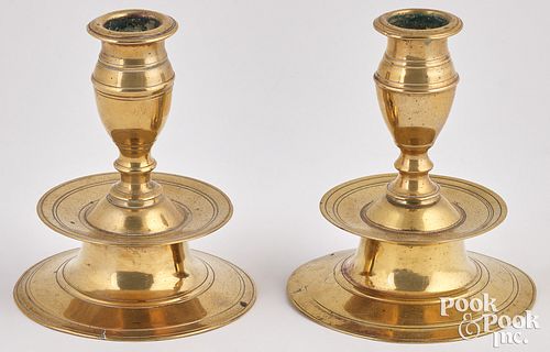 Pair of brass tapersticks, early 18th c.