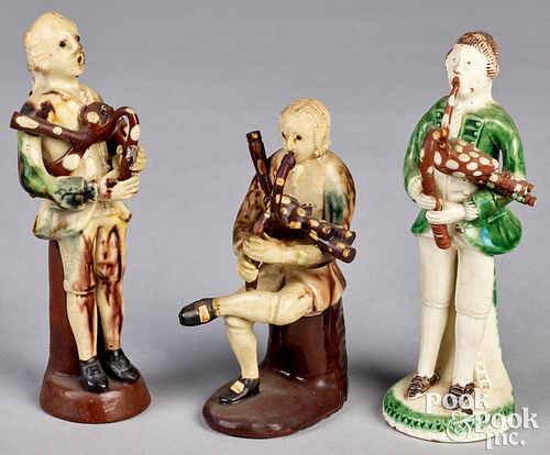 Three English ceramic Astbury type bagpipers