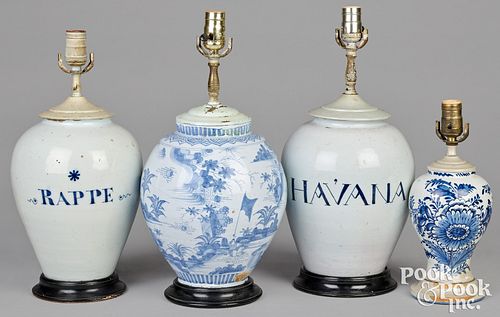 Four Delftware table lamps, 18th c.