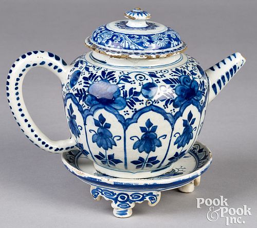 Delftware blue and white teapot and stand