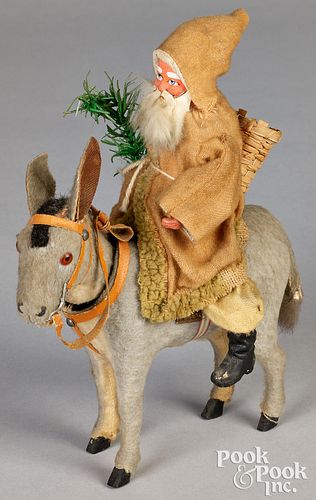 Santa Claus riding a nodding donkey