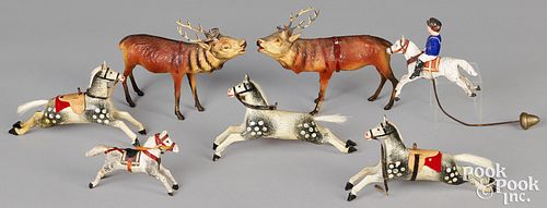 Four stick leg horse toys and two reindeer