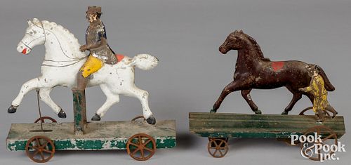 Two painted tin horse platform pull toys, 19th c.