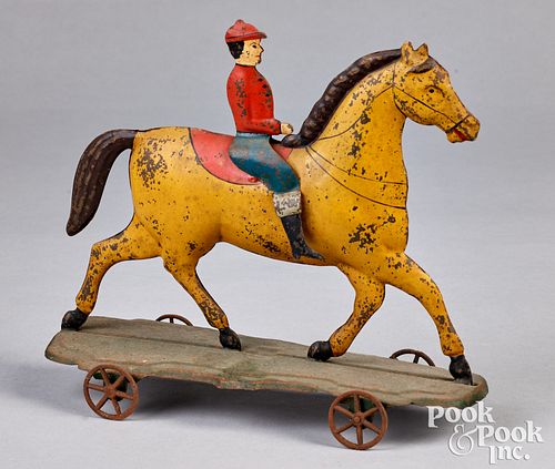 Fallows painted tin horse and rider pull toy