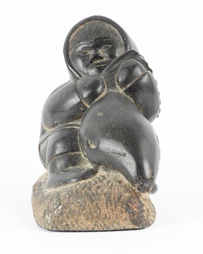 INUIT  CARVED SOAPSTONE H 5.5" L 7.5" ESKIMO WITH SEAL 