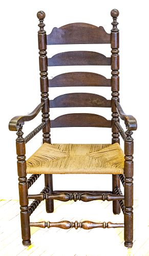 LADDER BACK OPEN ARM CHAIR, RUSH SEAT.  H 50" W 25" 