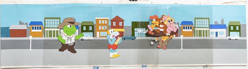 "THE MUPPET BABIES" PRODUCTION ANIMATION CELS WITH HAND PAINTED BACKGROUND, C. 1980S, H 9", W 37" (VISIBLE IMAGE) 