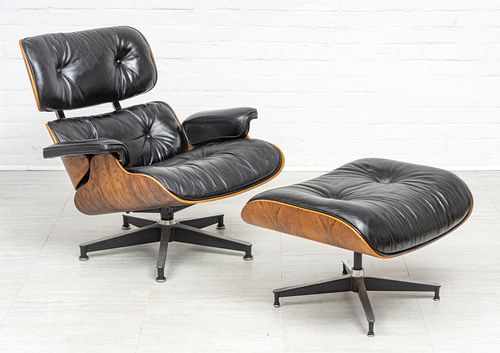 CHARLES AND RAY EAMES (AMERICAN), WALNUT AND BLACK LEATHER, 670 LOUNGE CHAIR AND 671 OTTOMAN DESIGNED 1956