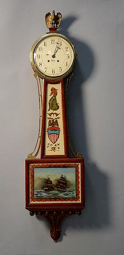 Chelsea banjo clock with reverse painted tablets of USS Constitution fighting the HMS Guerriere lower