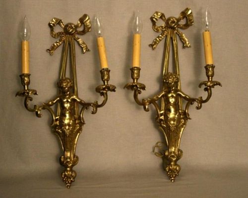 PAIR OF PUTTI POLISHED BRONZE 2 LIGHT SCONCES