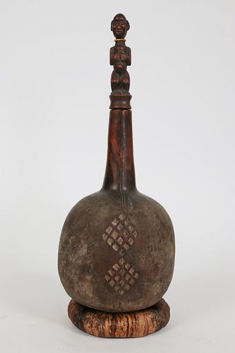 EAST AFRICAN, CARVED WOOD WITH PIGMENT AND BEADS BOTTLE WITH STOPPER H 17" DIA 7" 