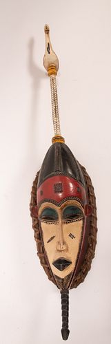AFRICAN POLYCHROME CARVED WOOD MASK, H 30", W 7"