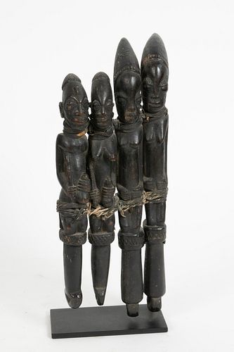 AFRICAN CARVED WOOD, PIGMENT AND LEATHER SEATED FIGURES (FOUR BOUND AS ONE) H 9.75-12.5" 