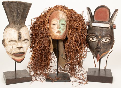 AFRICAN CARVED WOOD AND MIXED MEDIA MASKS H 14-15" 