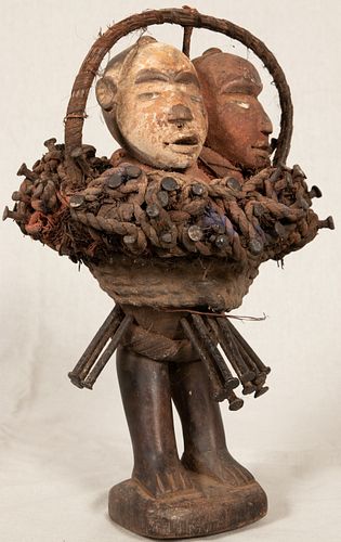 BAKONGO NKISI, DEMOCRATIC REPUBLIC OF CONGO,  AFRICAN CARVED WOOD, FIBER AND PIGMENT WITH GLASS EYES DOUBLE FACED NAIL FETISH, H 12", W 7" 