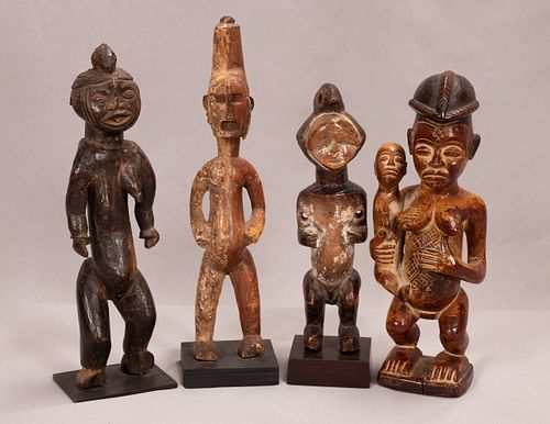NIGERIA, AFRICAN CARVED WOOD GROUP OF FOUR STANDING FIGURES H 10.75"-13.5" 