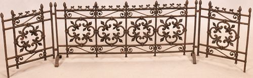 CONTINENTAL  HAND WROUGHT IRON "FLEUR DE LIS" FIREPLACE FENDER, IN 3 PARTS CIRCA 1900 H 20" W 43.5" 
