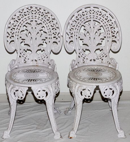 PAIR OF WHITE PAINTED CAST IRON SIDE CHAIRS H 34" DIA 15" 