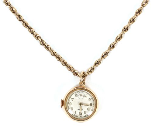 "CANTERBURY WATCH CO." SWISS MADE,  14KT YELLOW GOLD  WATCH ON A GOLD FILLED CHAIN L 28" DIA 0.75" 