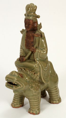 CHINESE CELADON BUDDHA RIDING ON A HIPPO, H 10", L 7" 
