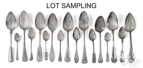 Large group of antique pewter spoons.
