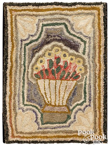 American hooked rug with vase of flowers
