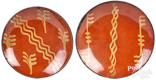 Two Pennsylvania slip decorated redware plates
