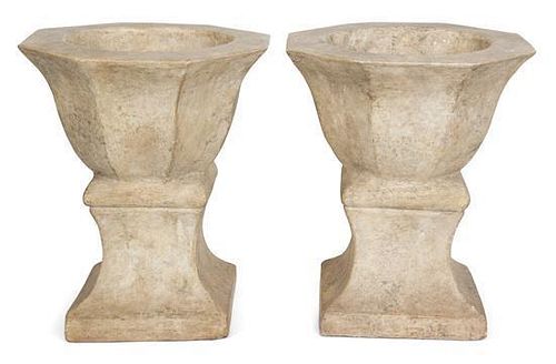 A Pair of Cast Stone Urns Height 15 1/2 inches.