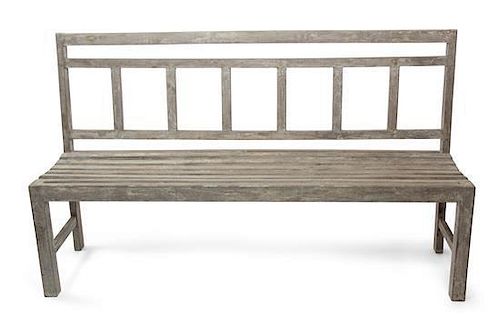 A Weathered Wooden Garden Bench Height 37 x width 63 inches.