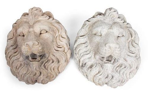 A Pair of Stone Lion Head Wall Mounts Height 18 1/2 inches.