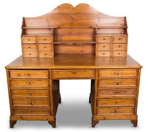 A Greek Pine Desk Height 60 x width 63 x depth 30 inches.