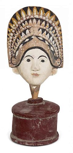 A Balinese Painted and Carved Wood Face Height 11 1/2 inches.