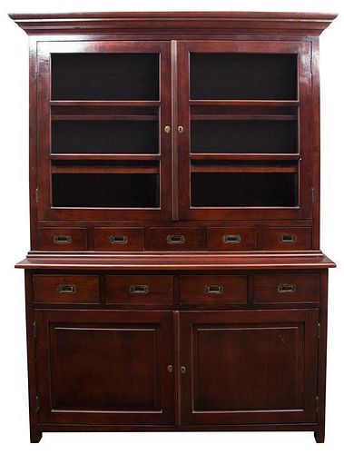 A Balinese Brass Mounted Mahogany Bookcase Height 82 3/4 x width 56 1/2 x depth 19 1/4 inches.