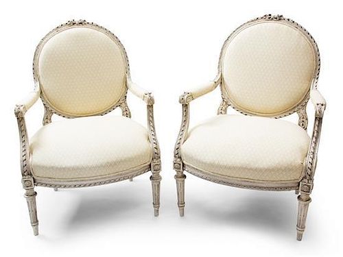 A Pair of Louis XVI Style Painted Fauteuils Height 39 3/4 inches.