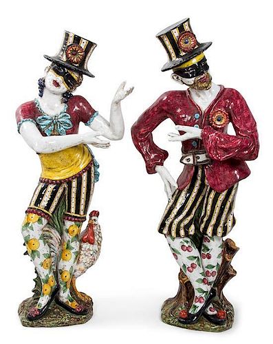 A Pair of Italian Glazed Ceramic Figures on Pedestals Height of taller 57 1/2 inches.